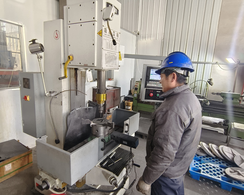 Manufacturing with CNC drilling machine.